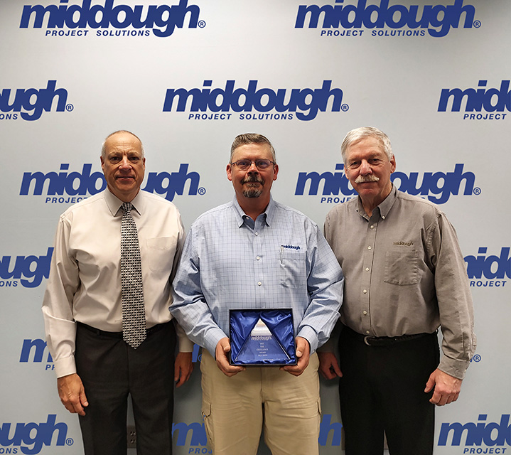 Bill Zato holding award